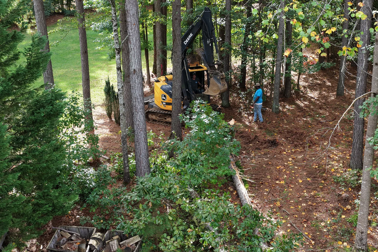 Titan Built excavator taking down trees on a land clearing job in Mooresville, NC